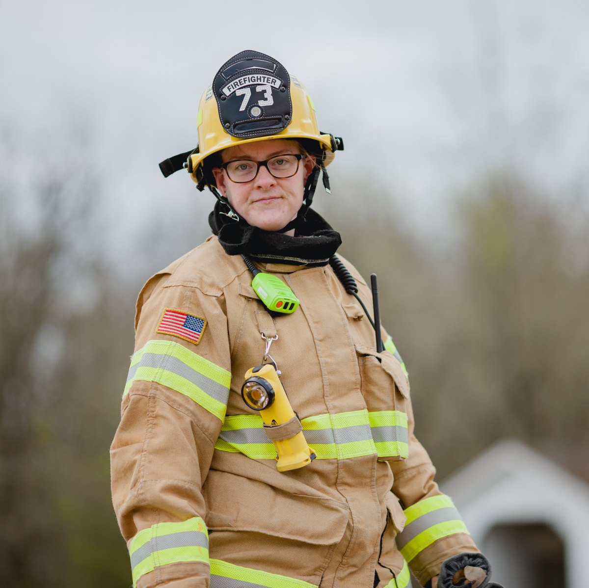 Firefighter standing with gear